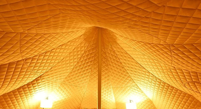 Tent Liners & Insulation - image of quilted tent liner installed in a bell tent. Essential bit of kit for adding extra warmth and insulation on your camping & glamping trips. Lotus Belle